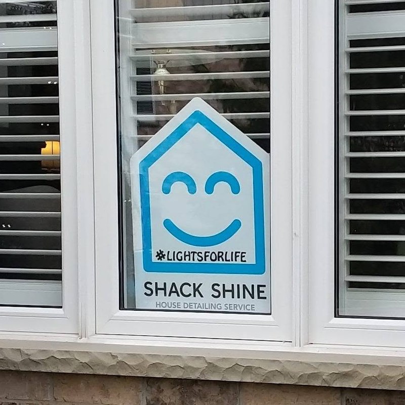 Shack Shine window decal in a customer's window